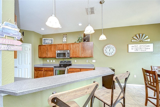 6519 Twin Bridges Dr, Zephyrhills, FL 33541 - kitchen featuring stainless steel appliances, light countertops, baseboards, pendant lighting, and recessed lighting