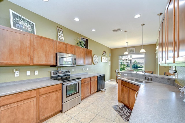6519 Twin Bridges Dr, Zephyrhills, FL 33541 - kitchen featuring appliances with stainless steel finishes, a sink, recessed lighting, hanging light fixtures, and a chandelier