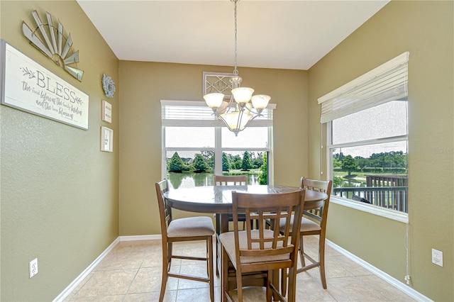 6519 Twin Bridges Dr, Zephyrhills, FL 33541 - dining space with a chandelier, baseboards, and light tile patterned floors