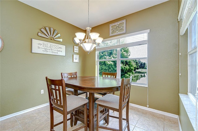 6519 Twin Bridges Dr, Zephyrhills, FL 33541 - dining area with a chandelier, baseboards, and light tile patterned floors