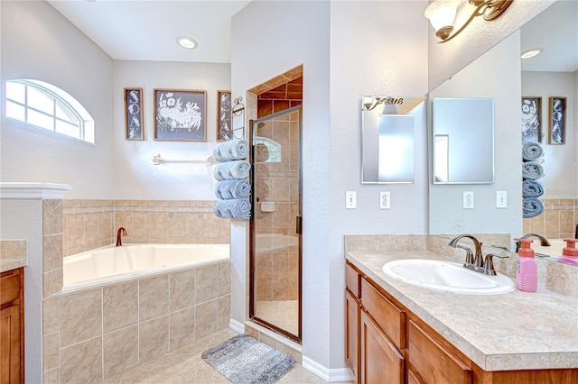 6519 Twin Bridges Dr, Zephyrhills, FL 33541 - full bath with vanity, a garden tub, a shower stall, and tile patterned floors
