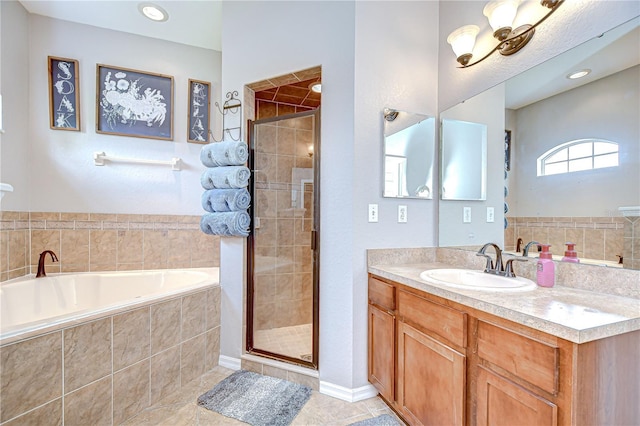 6519 Twin Bridges Dr, Zephyrhills, FL 33541 - full bathroom with a bath, vanity, a stall shower, and tile patterned floors