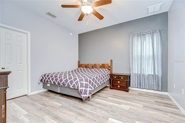 6519 Twin Bridges Dr, Zephyrhills, FL 33541 - bedroom featuring wood finished floors, baseboards, and a ceiling fan