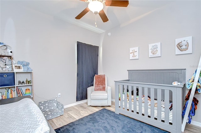 6519 Twin Bridges Dr, Zephyrhills, FL 33541 - bedroom featuring wood finished floors, vaulted ceiling, baseboards, and a ceiling fan