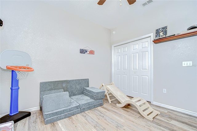 6519 Twin Bridges Dr, Zephyrhills, FL 33541 - game room with a ceiling fan, wood finished floors, and baseboards
