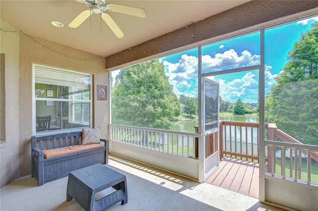 6519 Twin Bridges Dr, Zephyrhills, FL 33541 - sunroom with a water view, view of scattered trees, and a ceiling fan