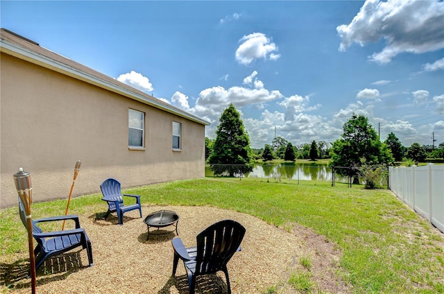 6519 Twin Bridges Dr, Zephyrhills, FL 33541 - view of yard with an outdoor fire pit and a water view