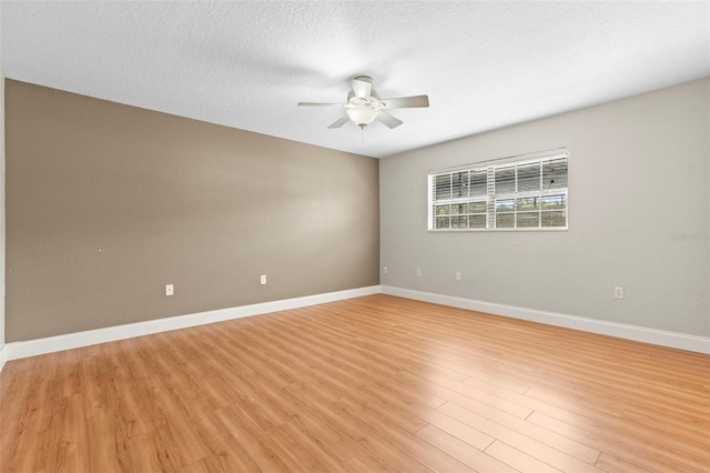 6100 Gulfport Blvd S Unit 114, Gulfport, FL 33707 - empty room featuring ceiling fan, light wood-style flooring, and baseboards