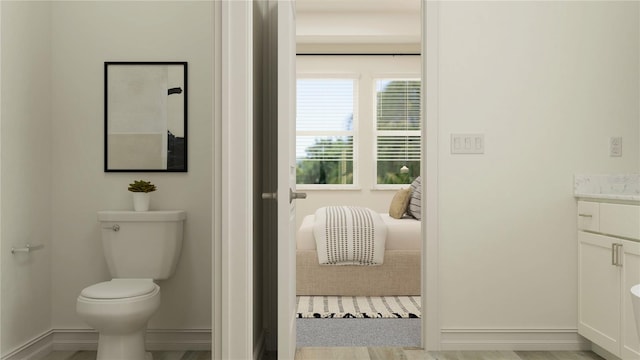 18154 Serene Lake Loop, Lutz, FL 33548 - bathroom with baseboards, toilet, and vanity