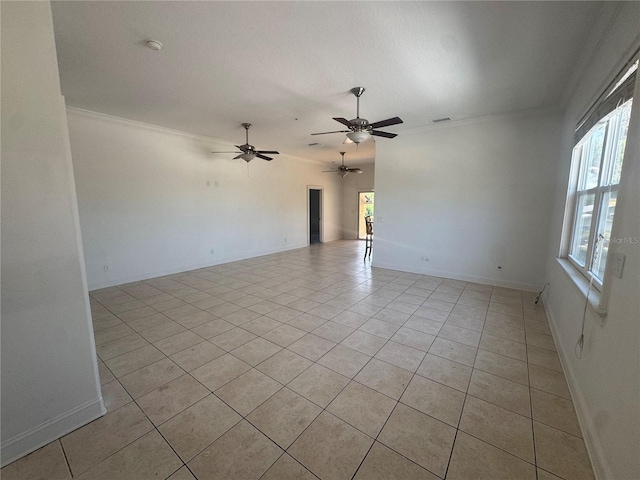7330 New York Ave, Hudson, FL 34667 - spare room featuring light tile patterned floors, ornamental molding, ceiling fan, baseboards, and a smoke detector