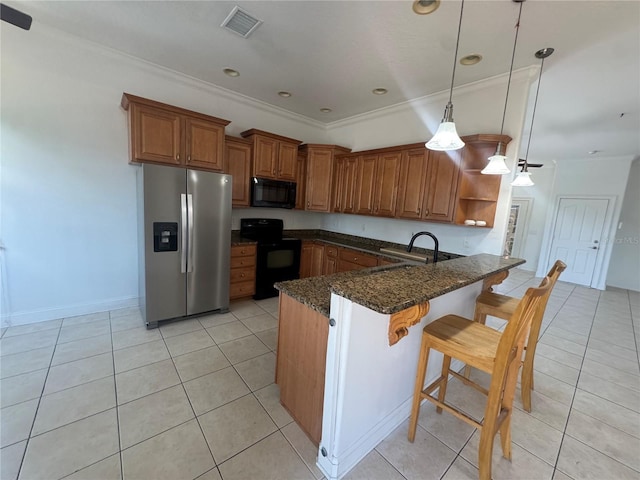 7330 New York Ave, Hudson, FL 34667 - kitchen featuring black appliances, brown cabinetry, a peninsula, open shelves, and light tile patterned flooring