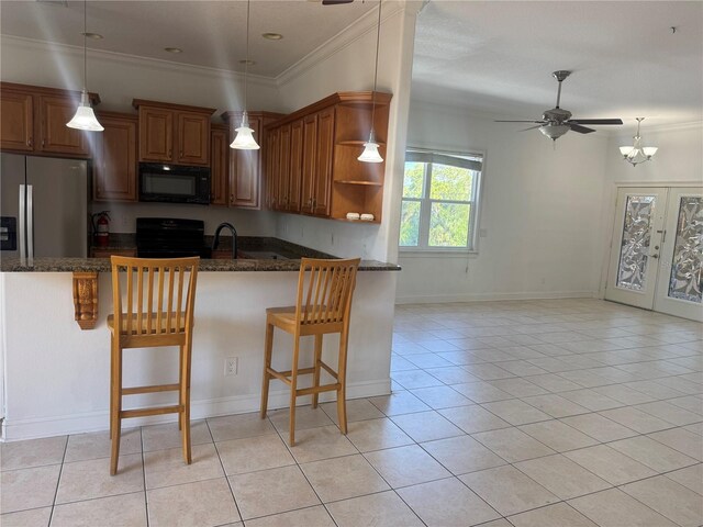7330 New York Ave, Hudson, FL 34667 - kitchen featuring black appliances, open shelves, light tile patterned flooring, dark stone countertops, and ornamental molding