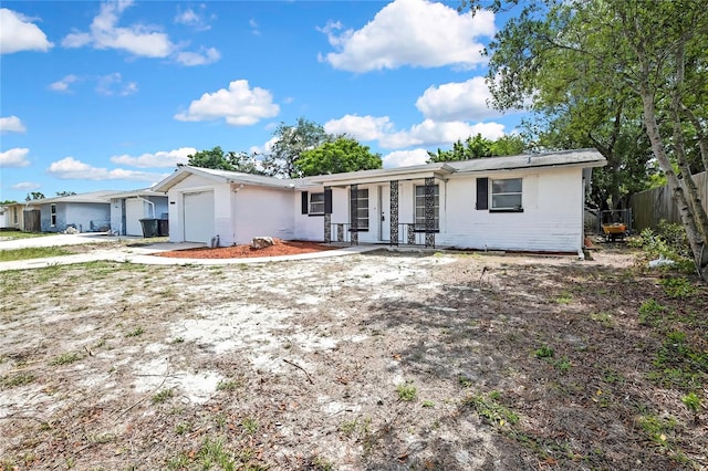 11130 White Oak Ln, Port Richey, FL 34668 - ranch-style house with an attached garage and a porch