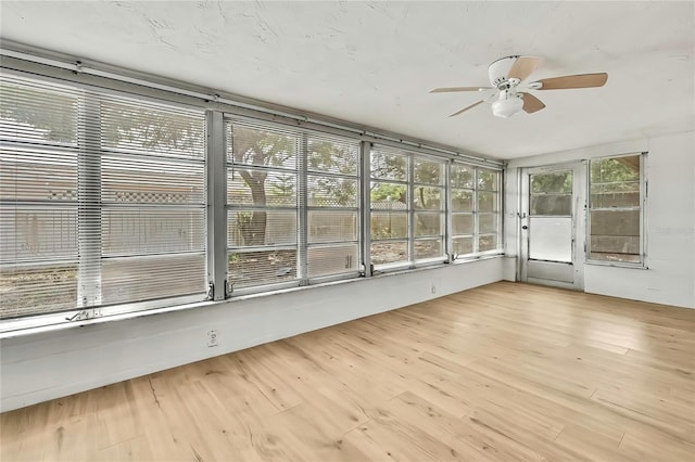 11130 White Oak Ln, Port Richey, FL 34668 - unfurnished sunroom with wood finished floors