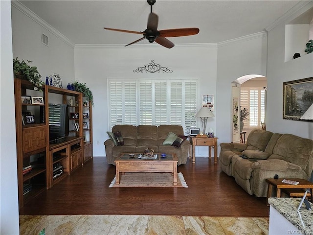 4755 N El Camino Dr, Beverly Hills, FL 34465 - living area featuring a ceiling fan, arched walkways, ornamental molding, and wood finished floors