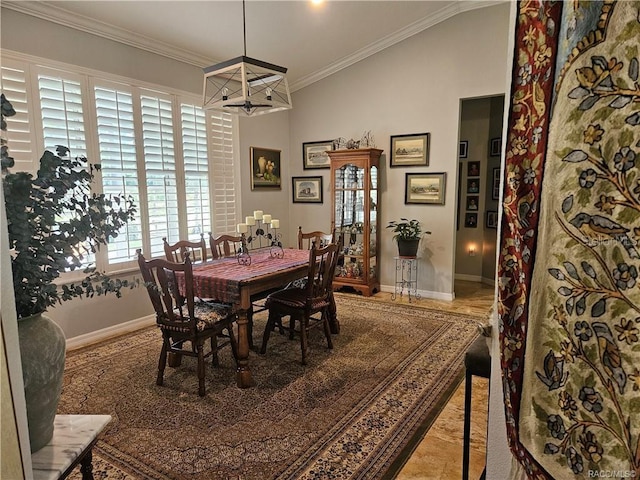 4755 N El Camino Dr, Beverly Hills, FL 34465 - dining space with crown molding, baseboards, and lofted ceiling