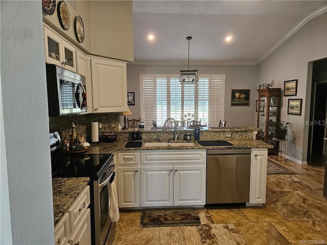 4755 N El Camino Dr, Beverly Hills, FL 34465 - kitchen with appliances with stainless steel finishes, a sink, a peninsula, ornamental molding, and white cabinets