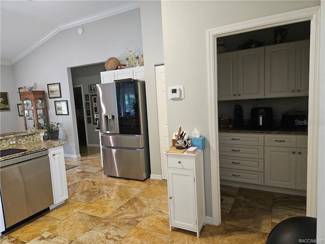 4755 N El Camino Dr, Beverly Hills, FL 34465 - kitchen featuring stainless steel appliances, ornamental molding, vaulted ceiling, white cabinets, and baseboards