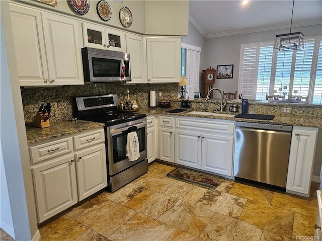 4755 N El Camino Dr, Beverly Hills, FL 34465 - kitchen with stainless steel appliances, a sink, decorative backsplash, stone tile floors, and ornamental molding
