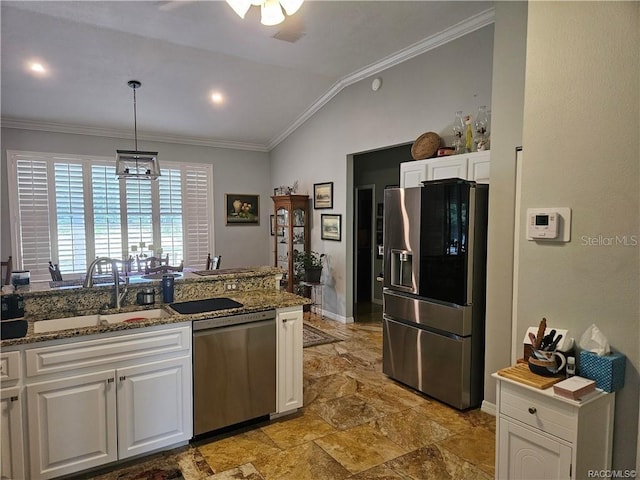 4755 N El Camino Dr, Beverly Hills, FL 34465 - kitchen with appliances with stainless steel finishes, stone tile flooring, crown molding, white cabinetry, and a sink