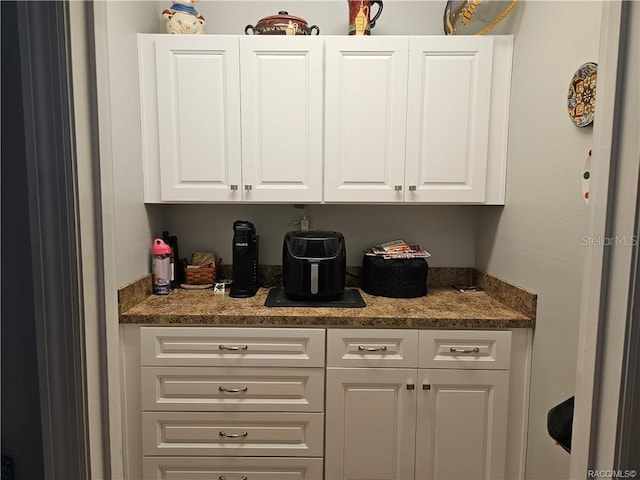 4755 N El Camino Dr, Beverly Hills, FL 34465 - kitchen with white cabinets and light stone countertops