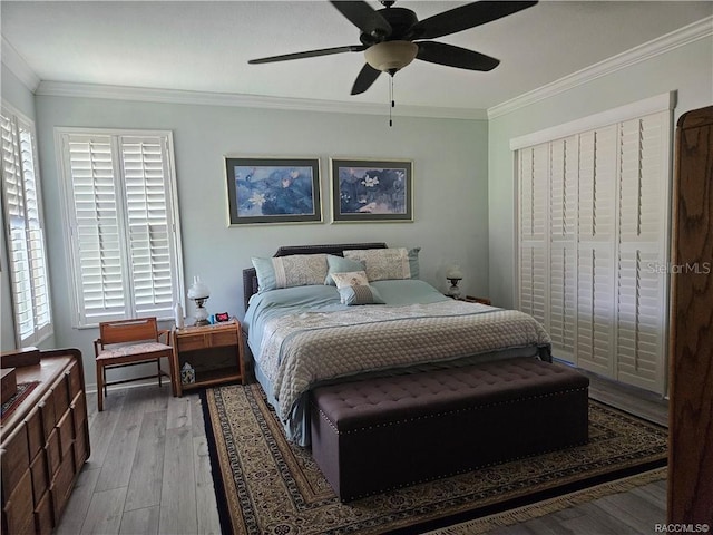 4755 N El Camino Dr, Beverly Hills, FL 34465 - bedroom featuring wood-type flooring, ornamental molding, a ceiling fan, and baseboards