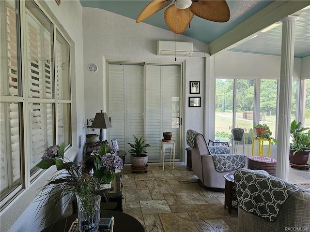 4755 N El Camino Dr, Beverly Hills, FL 34465 - sunroom / solarium featuring vaulted ceiling, stone tile flooring, a wall mounted AC, and a textured wall