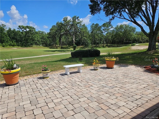 4755 N El Camino Dr, Beverly Hills, FL 34465 - view of patio / terrace with view of wooded area