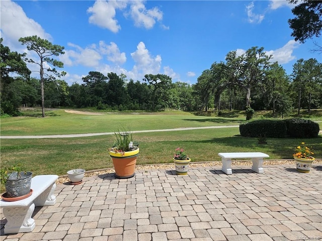 4755 N El Camino Dr, Beverly Hills, FL 34465 - view of patio / terrace with view of wooded area
