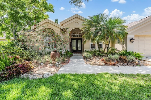 4320 Auston Way, Palm Harbor, FL 34685 - view of front of property with french doors and stucco siding