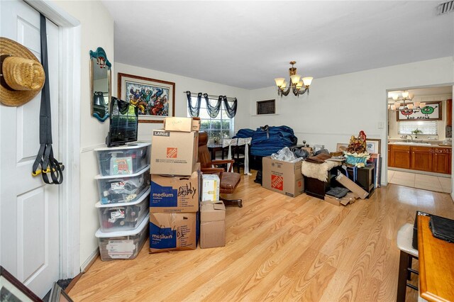 1683 Pine St, Largo, FL 33774 - dining space with a chandelier and light wood-style flooring