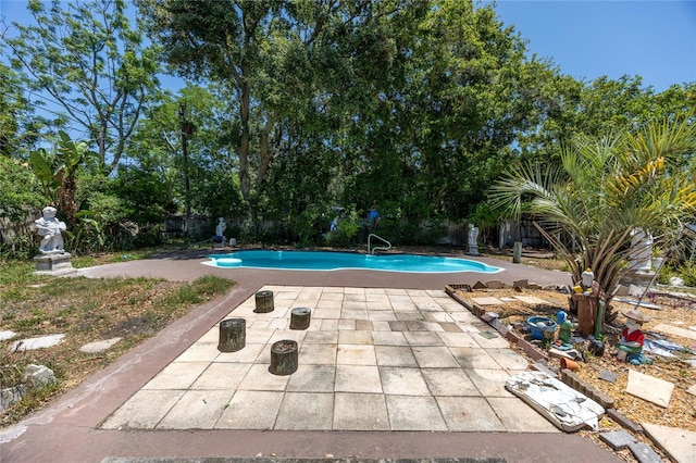 1683 Pine St, Largo, FL 33774 - outdoor pool featuring a patio and a fenced backyard