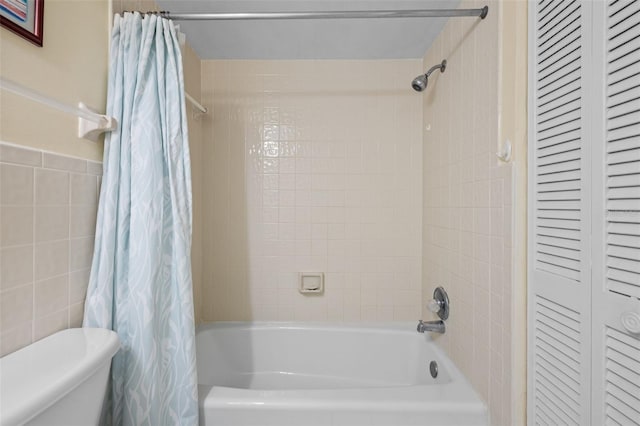 17710 Gulf Blvd Unit 304, Redington Shores, FL 33708 - full bathroom with shower / bath combo with shower curtain, a closet, and tile walls