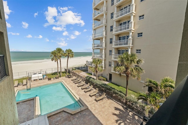 17710 Gulf Blvd Unit 304, Redington Shores, FL 33708 - community pool with view of water and beach and a patio
