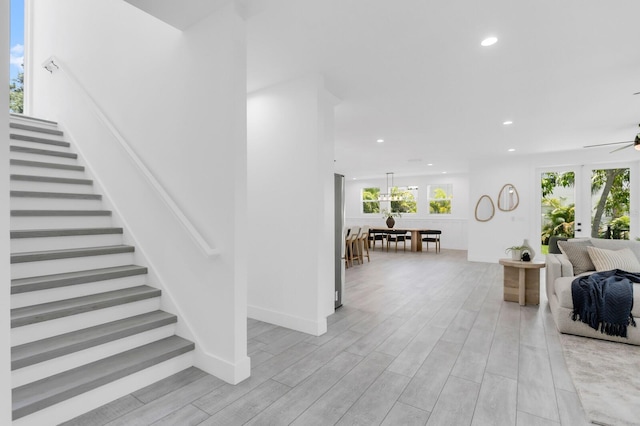 3616 W Anderson Ave, Tampa, FL 33611 - stairway featuring a ceiling fan, recessed lighting, and wood finished floors