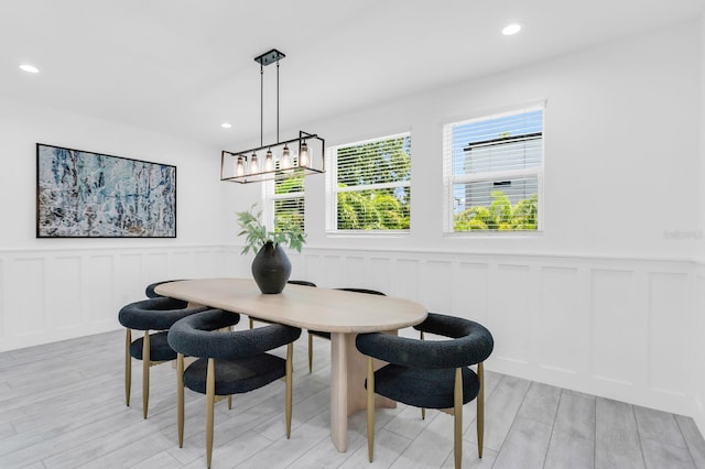 3616 W Anderson Ave, Tampa, FL 33611 - dining space featuring a decorative wall, light wood-type flooring, wainscoting, and recessed lighting