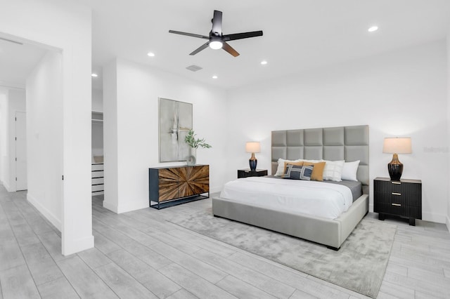 3616 W Anderson Ave, Tampa, FL 33611 - bedroom featuring light wood-style flooring, recessed lighting, baseboards, a walk in closet, and ceiling fan