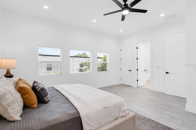 3616 W Anderson Ave, Tampa, FL 33611 - bedroom with light wood finished floors, recessed lighting, baseboards, and ceiling fan