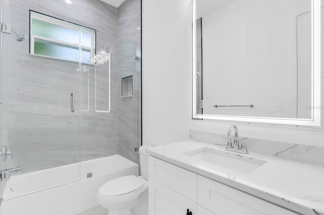3616 W Anderson Ave, Tampa, FL 33611 - full bathroom with vanity, toilet, and shower / bath combination with glass door