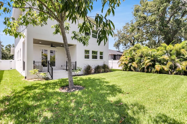 3616 W Anderson Ave, Tampa, FL 33611 - back of property with ceiling fan and stucco siding