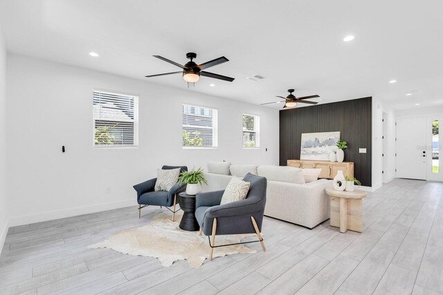 3616 W Anderson Ave, Tampa, FL 33611 - living area featuring ceiling fan, plenty of natural light, light wood-style floors, recessed lighting, and baseboards
