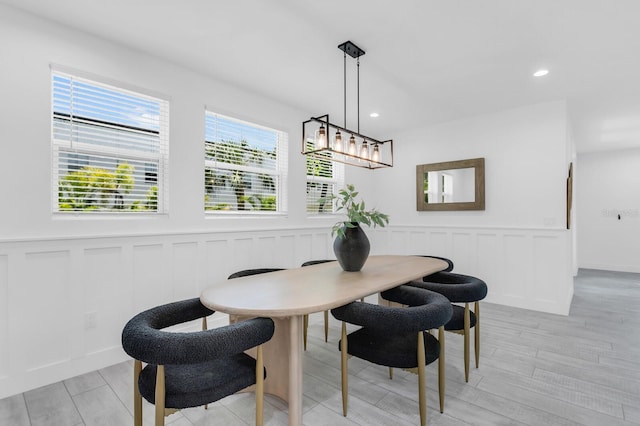 3616 W Anderson Ave, Tampa, FL 33611 - dining room with a decorative wall, wainscoting, recessed lighting, and light wood finished floors