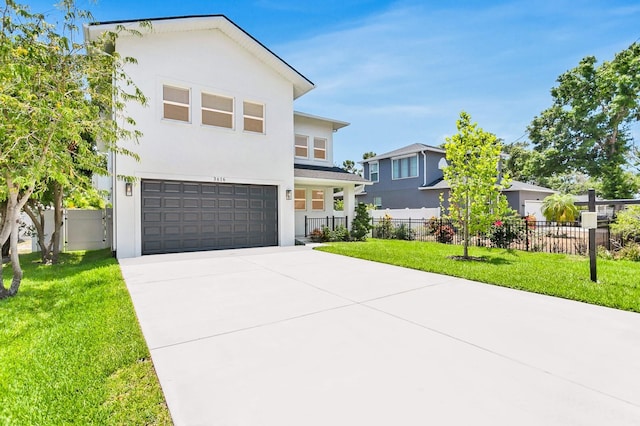 3616 W Anderson Ave, Tampa, FL 33611 - contemporary home with a garage, concrete driveway, and stucco siding