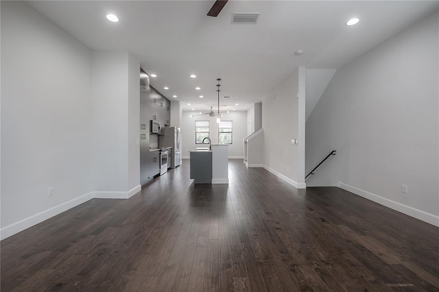 1330 W Gray St Unit 1, Tampa, FL 33606 - unfurnished living room with a sink, a ceiling fan, dark wood-type flooring, recessed lighting, and baseboards