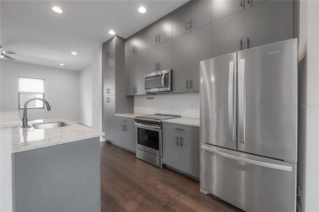 1330 W Gray St Unit 1, Tampa, FL 33606 - kitchen with appliances with stainless steel finishes, a sink, gray cabinets, dark wood-style flooring, and recessed lighting