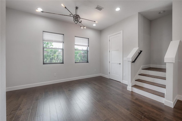 1330 W Gray St Unit 1, Tampa, FL 33606 - spare room featuring baseboards, a chandelier, dark wood-style floors, stairs, and recessed lighting
