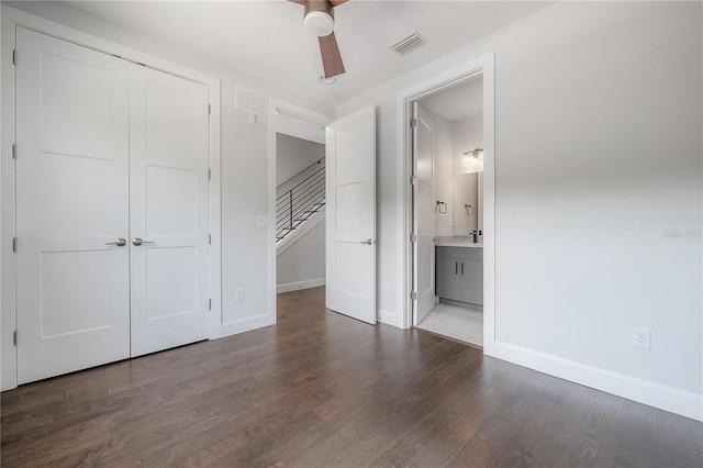 1330 W Gray St Unit 1, Tampa, FL 33606 - unfurnished bedroom with wood finished floors, baseboards, a closet, and ensuite bath