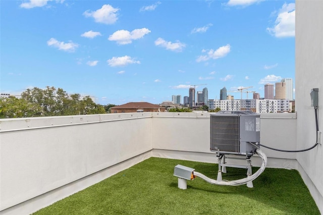 1330 W Gray St Unit 1, Tampa, FL 33606 - view of green lawn featuring a view of skyline, central air condition unit, and a balcony