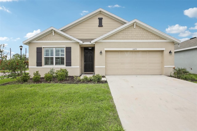 10233 Opaline Sky Pl, Riverview, FL 33578 - view of front facade with a front yard, an attached garage, concrete driveway, and stucco siding