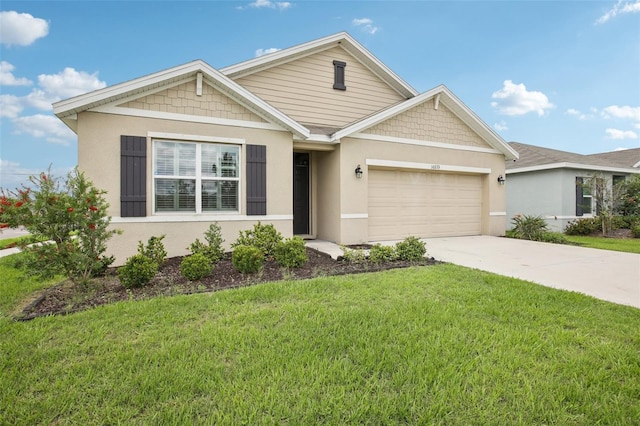 10233 Opaline Sky Pl, Riverview, FL 33578 - view of front facade featuring a garage, driveway, a front lawn, and stucco siding